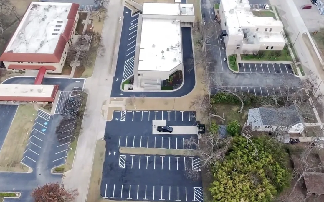 Sealcoated commercial asphalt surface